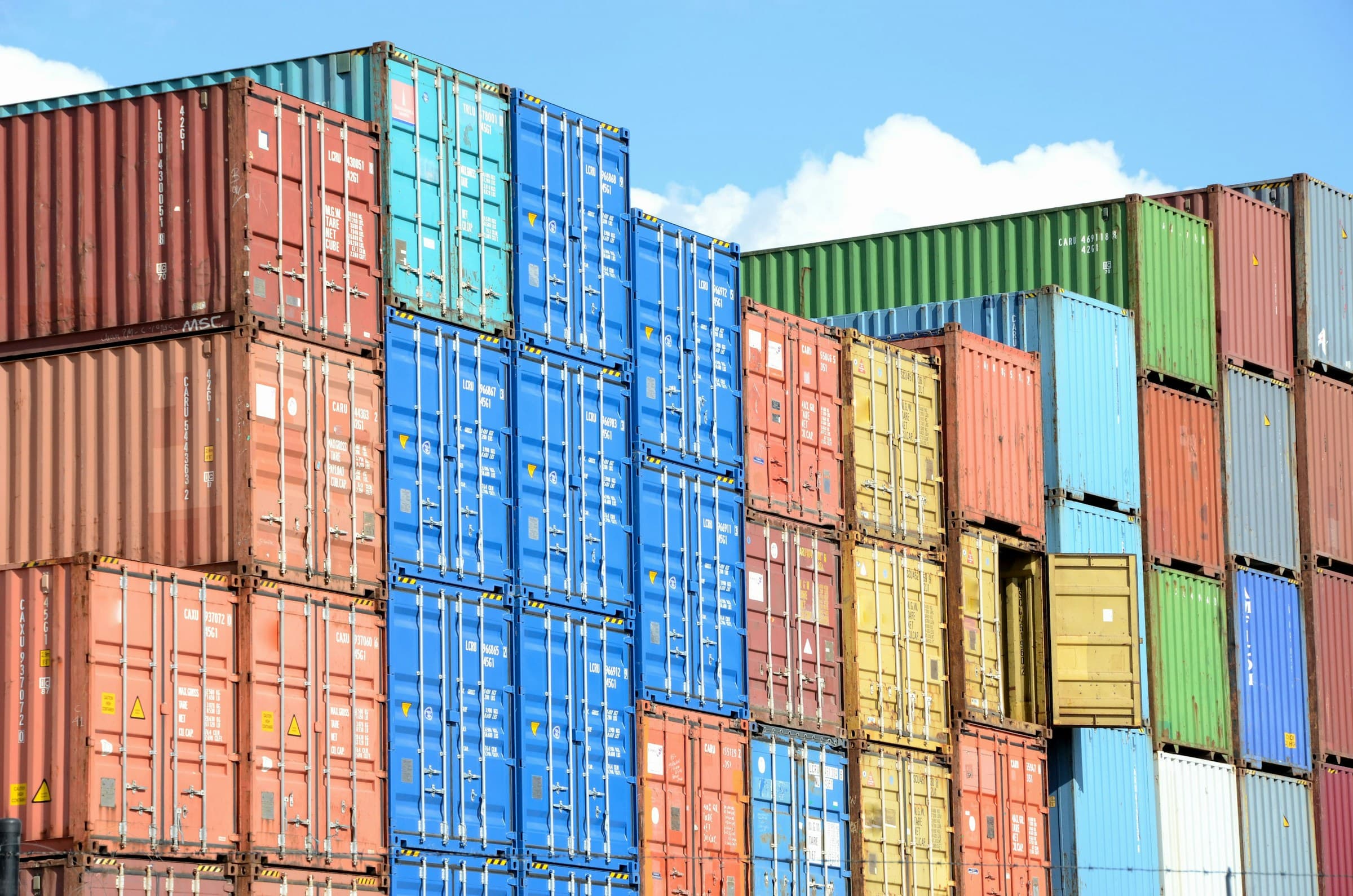 Modern logistics and shipping containers in a global port, representing B2B product sourcing.